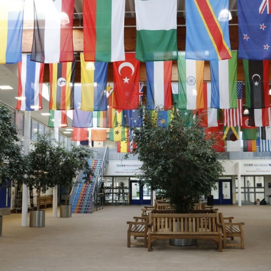 photo of the inside of the school showing flags